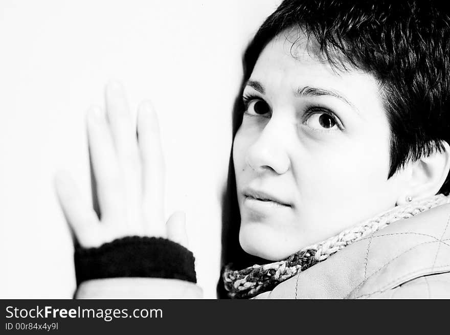 A view with a woman looking up thoughtful in black and white tones.