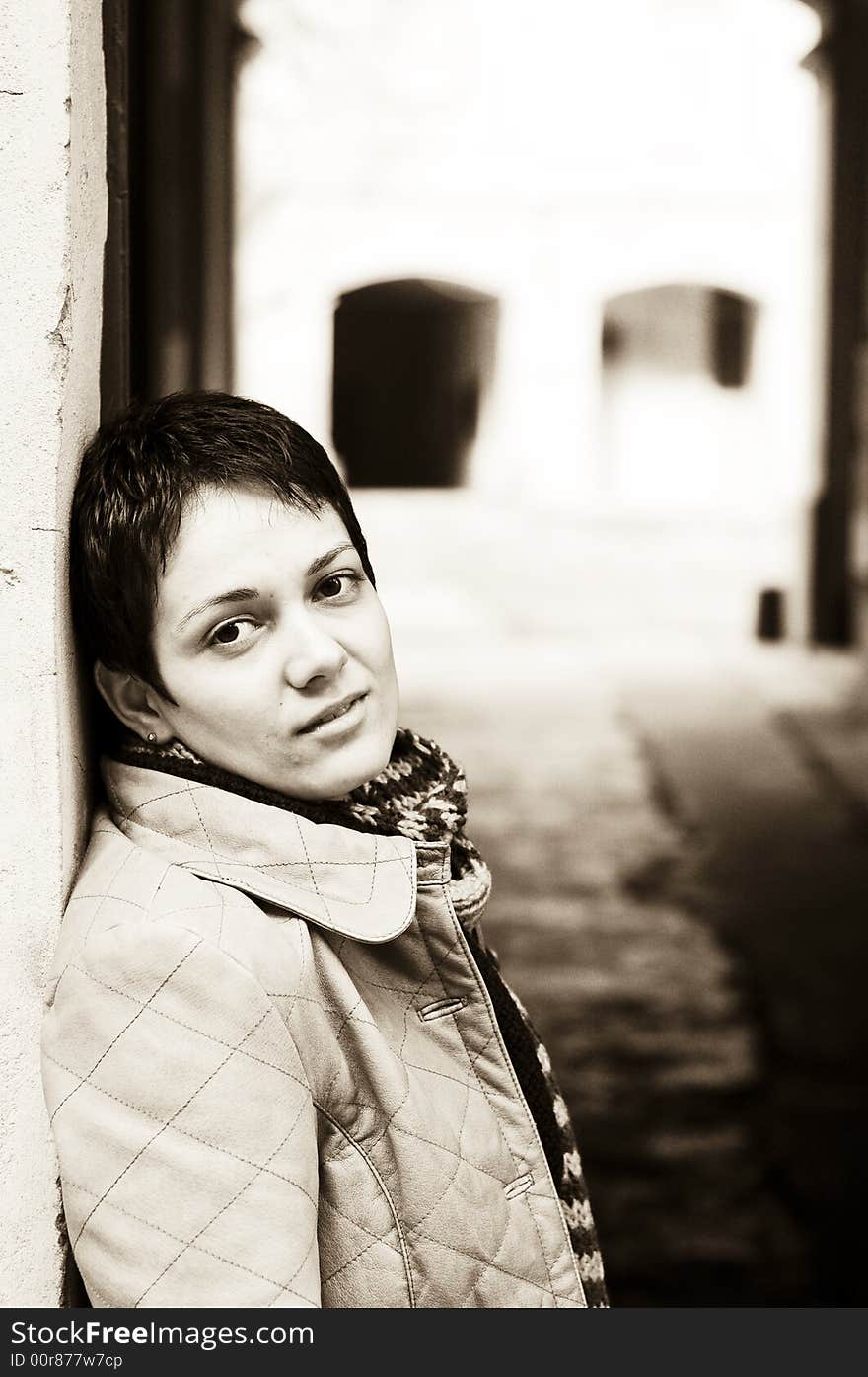 A view with a woman looking up thoughtful in sepia tones.