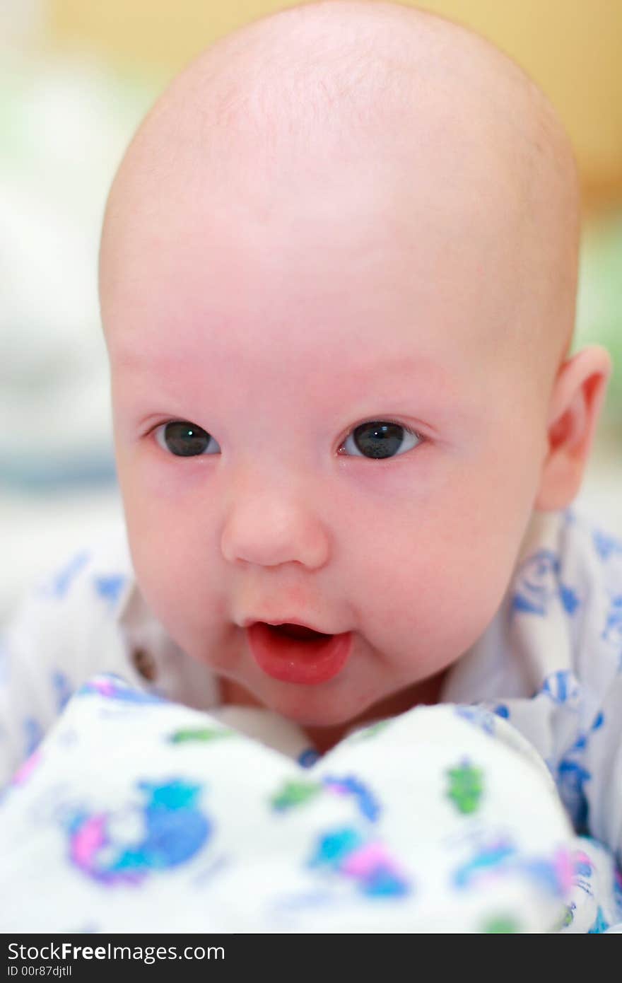 Baby on bed look at camera. Baby on bed look at camera