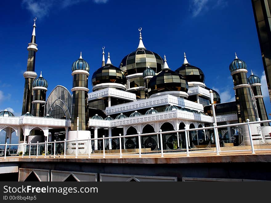 Mirror mosque on the blue sky background