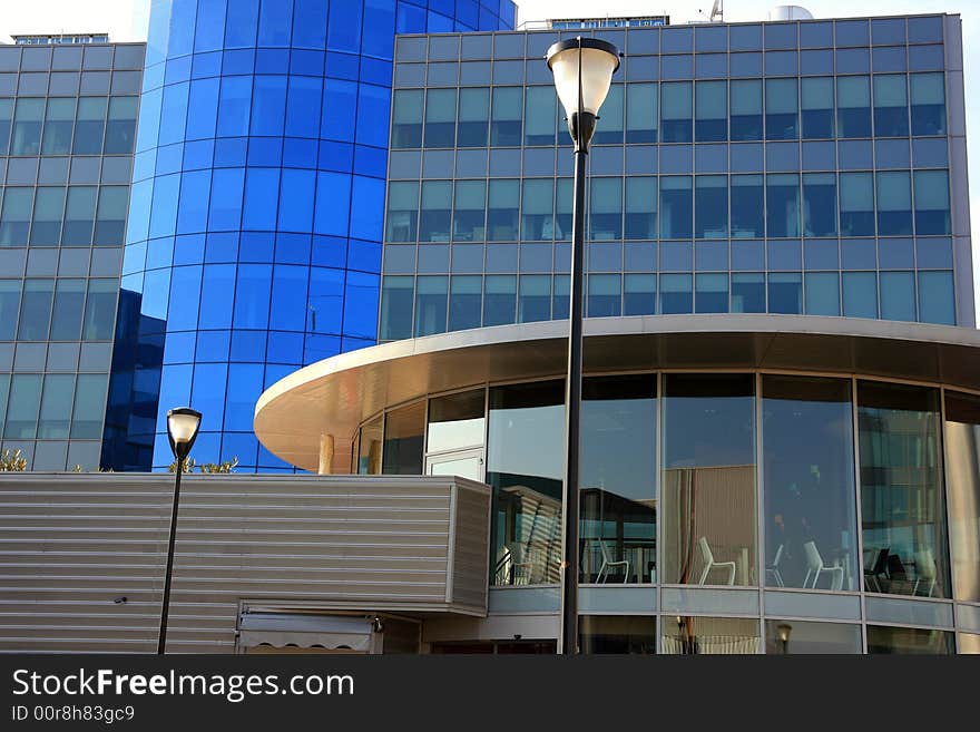 Modern work quarter -Blue buildings offices, and round coffe bar structure. Milan, Italy  . Modern work quarter -Blue buildings offices, and round coffe bar structure. Milan, Italy