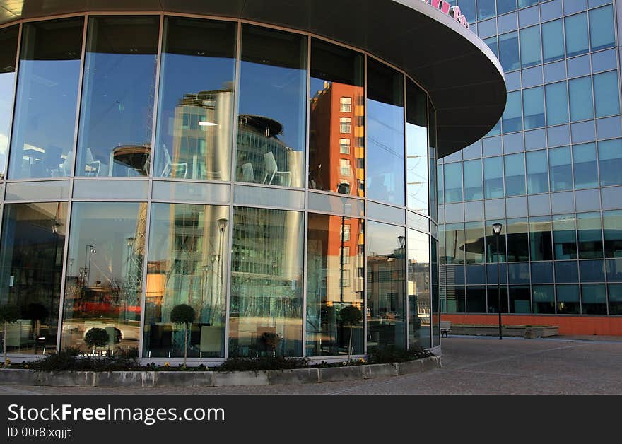 Modern work quarter - Blue buildings offices and round coffe bar structure. Italian architecture. Milan, Italy. Modern work quarter - Blue buildings offices and round coffe bar structure. Italian architecture. Milan, Italy