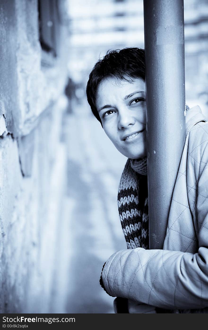 A view with a woman looking  thoughtful in blue tones.