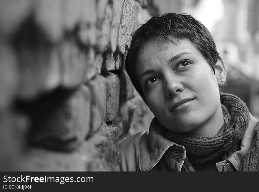 A view with a woman looking up thoughtful in black and white tones.