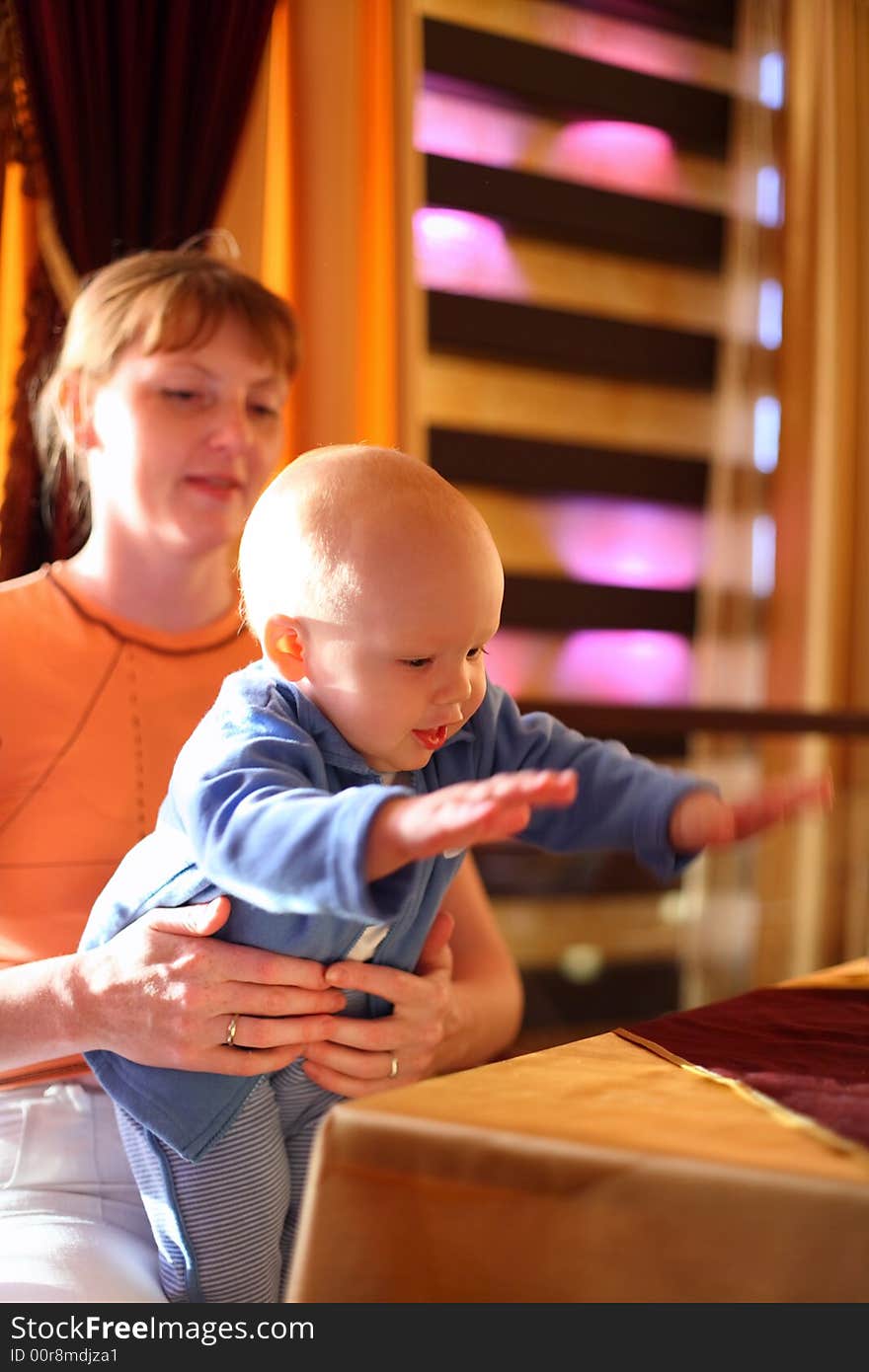 Mother holding enjoying baby