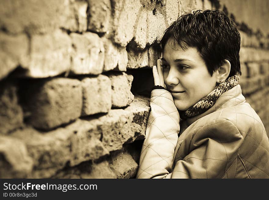 Woman looking thoughtful in sepia tones