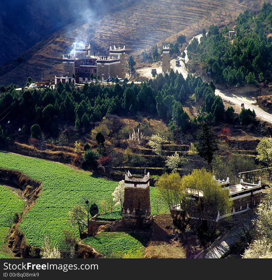 This photo is from Danba Qiang People Autonomous regions, Sichuan Provience, China.

Qiang People is one of the 55 minorities in China. They have a tradition of building castle(or towers) around there village. Because of the conflict around them.

But these castles no longer serve their origional purpose any more nowadays. The battlefield around the castles became farm,and the smoke in this picture is cooking smoke, instead of battle-warning smoke. This photo is from Danba Qiang People Autonomous regions, Sichuan Provience, China.

Qiang People is one of the 55 minorities in China. They have a tradition of building castle(or towers) around there village. Because of the conflict around them.

But these castles no longer serve their origional purpose any more nowadays. The battlefield around the castles became farm,and the smoke in this picture is cooking smoke, instead of battle-warning smoke.