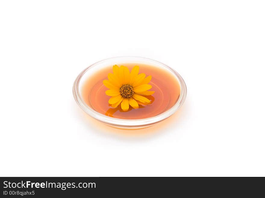 Herbal drink with flower isolated on white