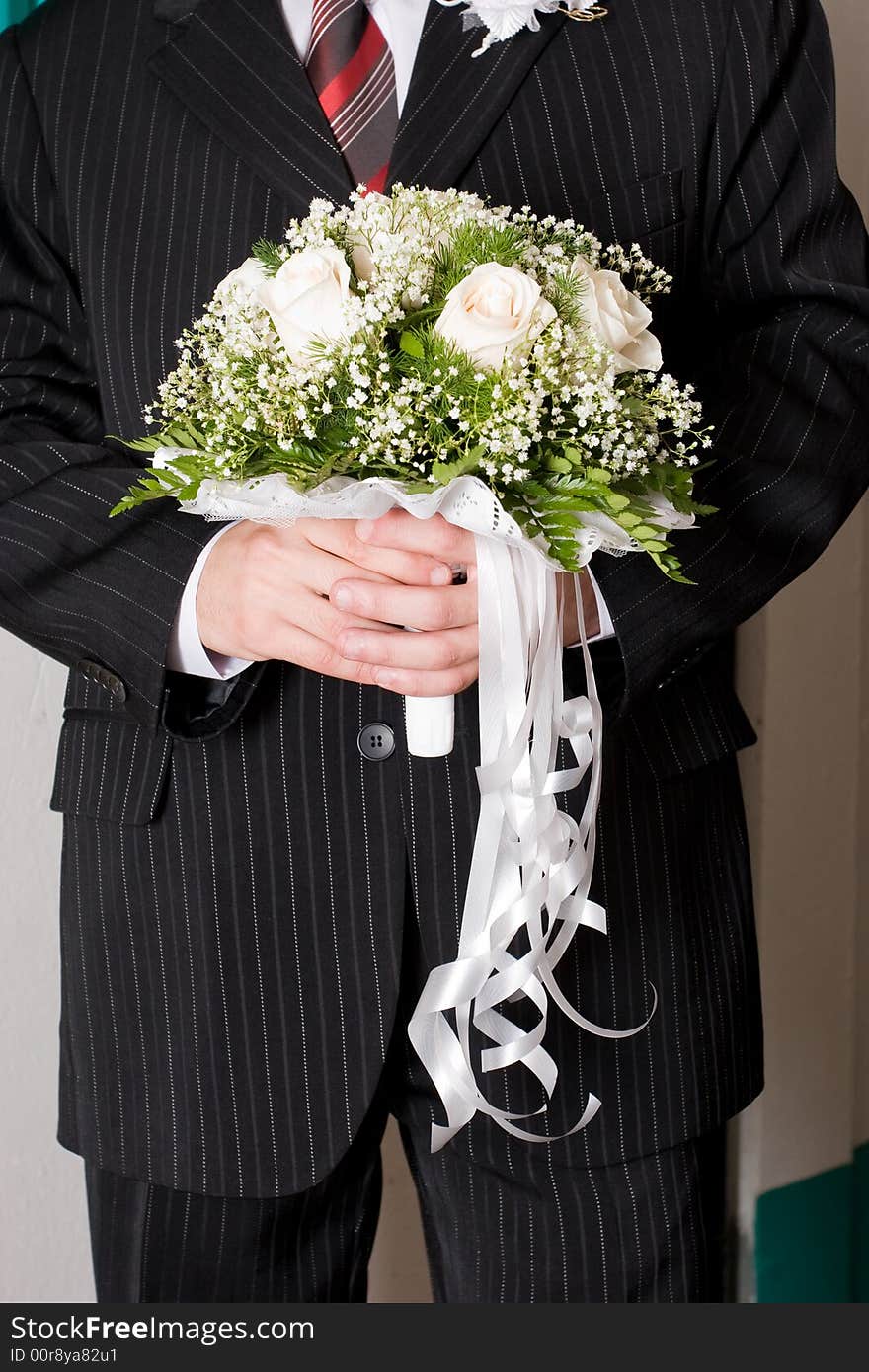 A beautiful rose bouquet in the hands of a man