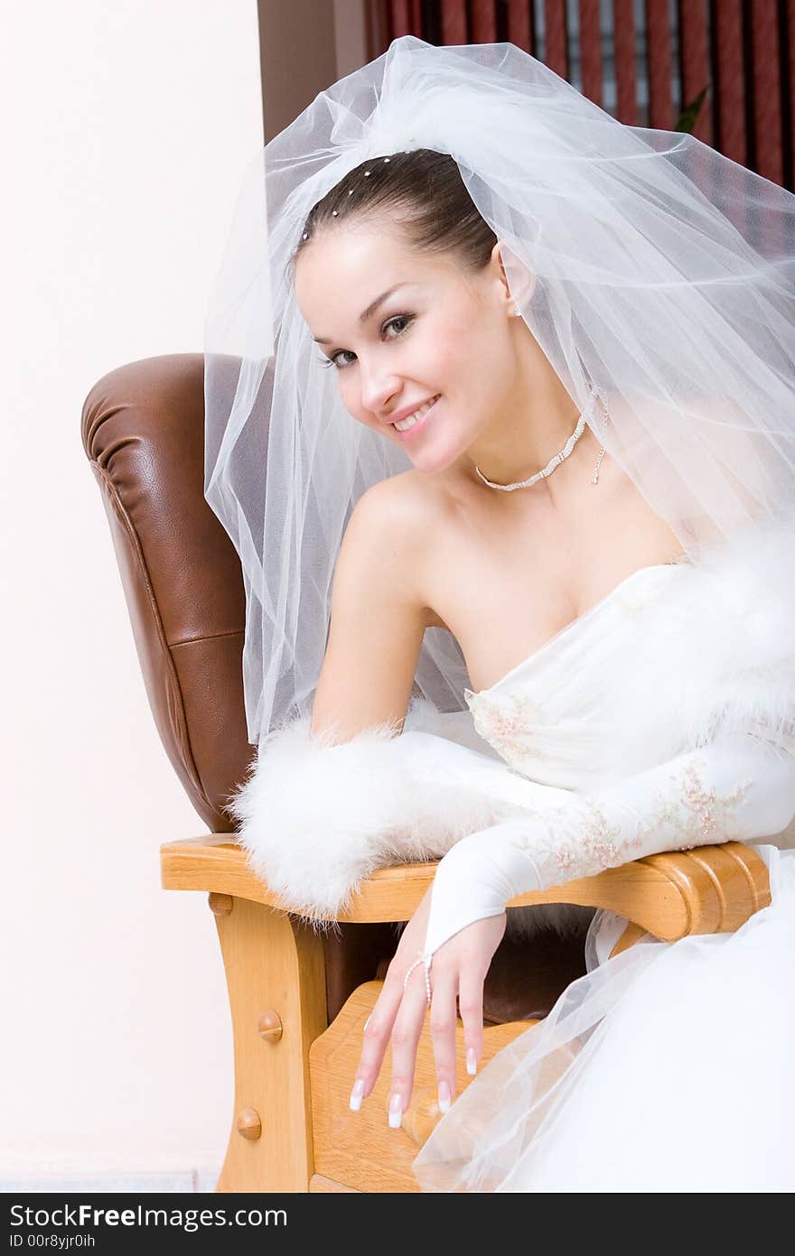 A Beautiful Bride In A Chair