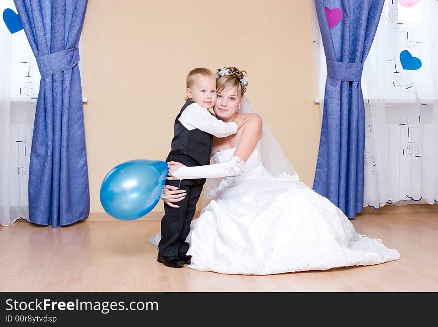 The bride embraces her little brother