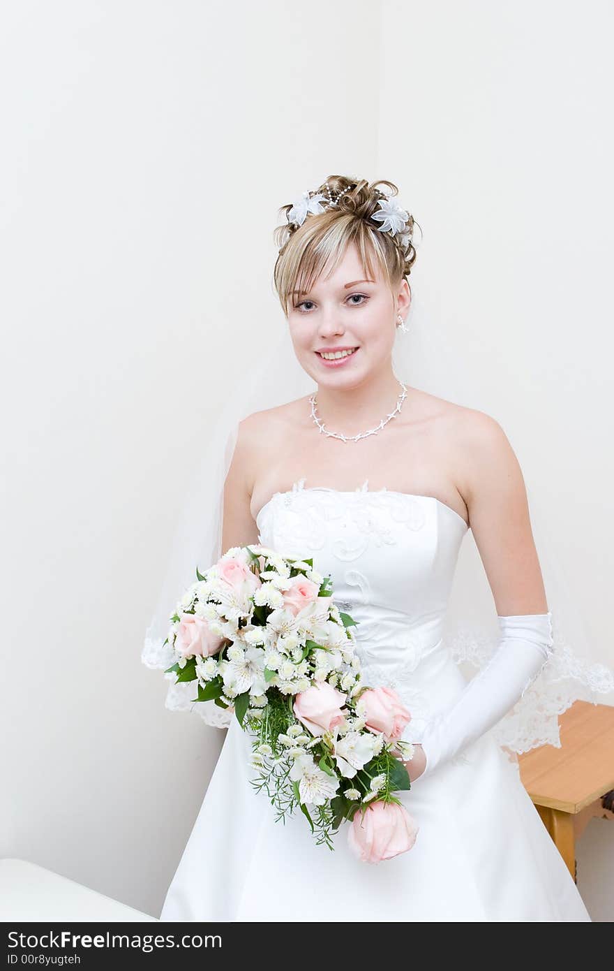 A beautiful bride with a flower bouquet