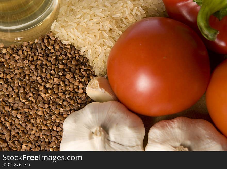 Healthy food : rice, groats, garlic, tomato