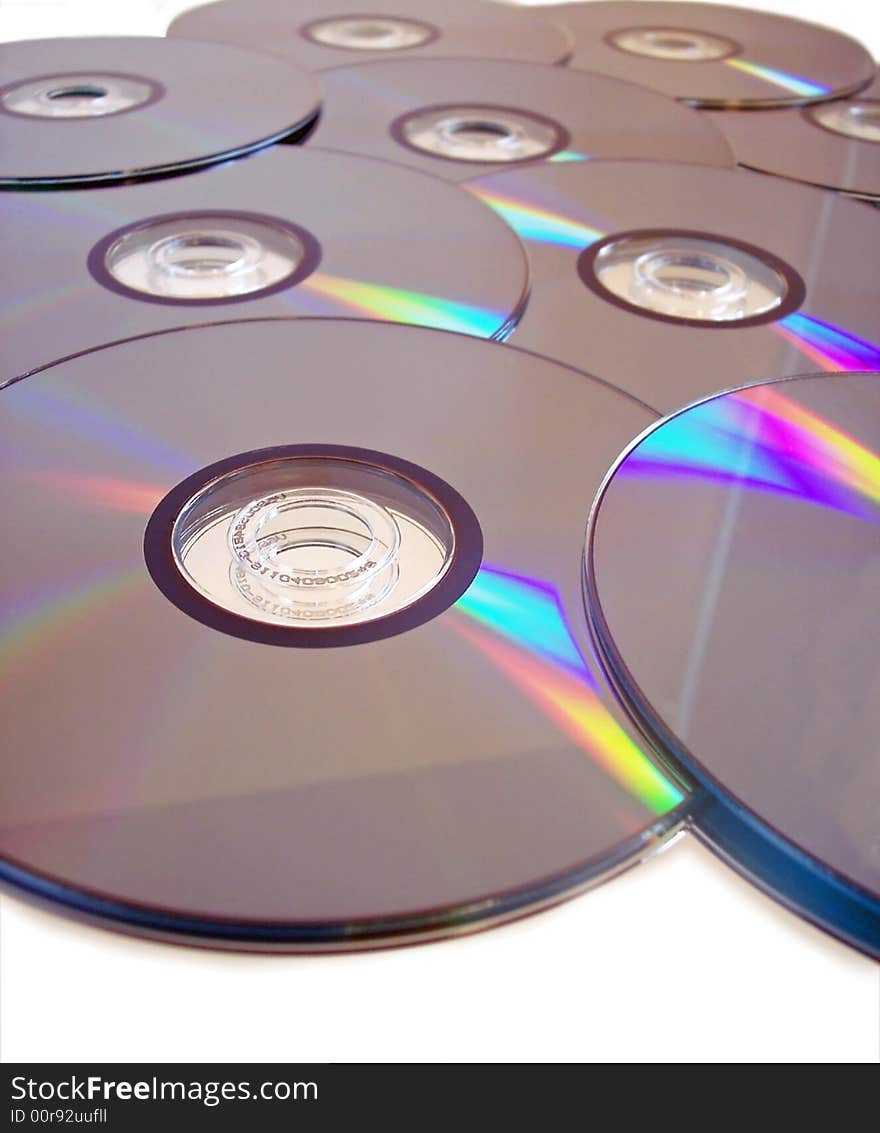 A number of compact discs arranged together over a white background