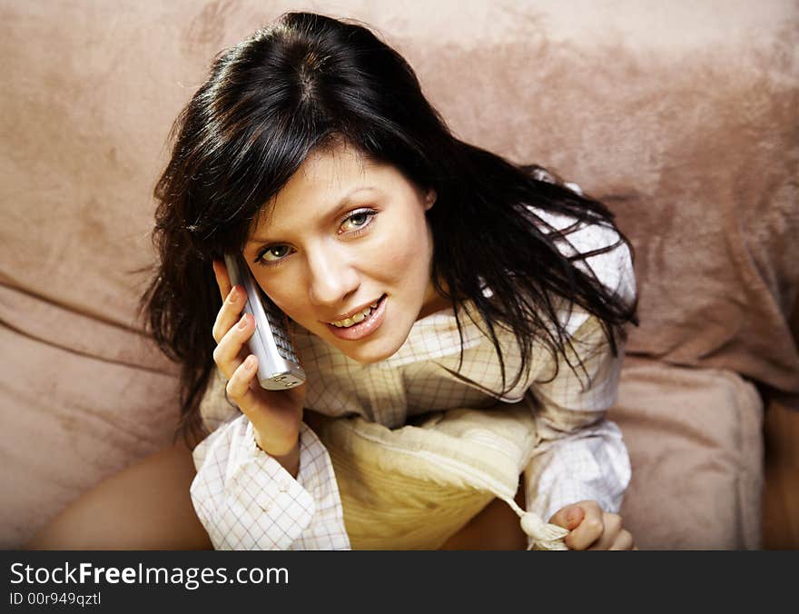 Young woman is speaking on cell phone