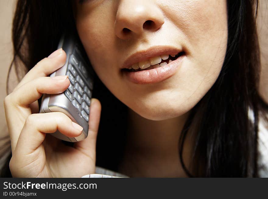 Young woman is speaking on cell phone