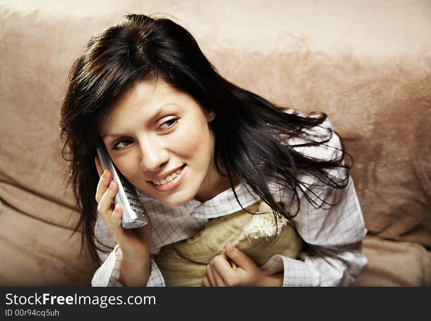 Young woman is speaking on cell phone