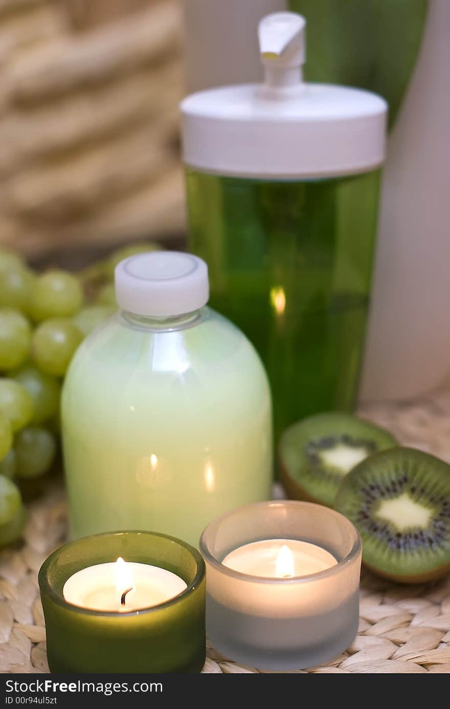 Decoration consisting of cosmetic bottles, some kiwis and candles. Green as dominating color. MORE SPA COMPOSITIONS ». Decoration consisting of cosmetic bottles, some kiwis and candles. Green as dominating color. MORE SPA COMPOSITIONS »