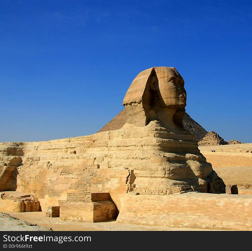 Sphinx in Giza area, Cairo, with Kufu pyramid in the behind