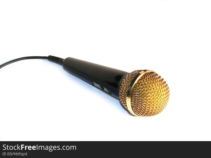 Golden microphone isolated on white background