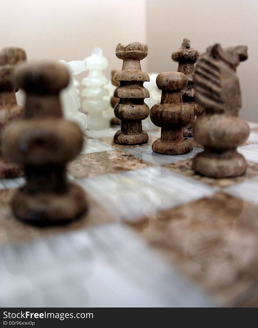 This is an image of several chess pieces arranged on a chess board. This is an image of several chess pieces arranged on a chess board.