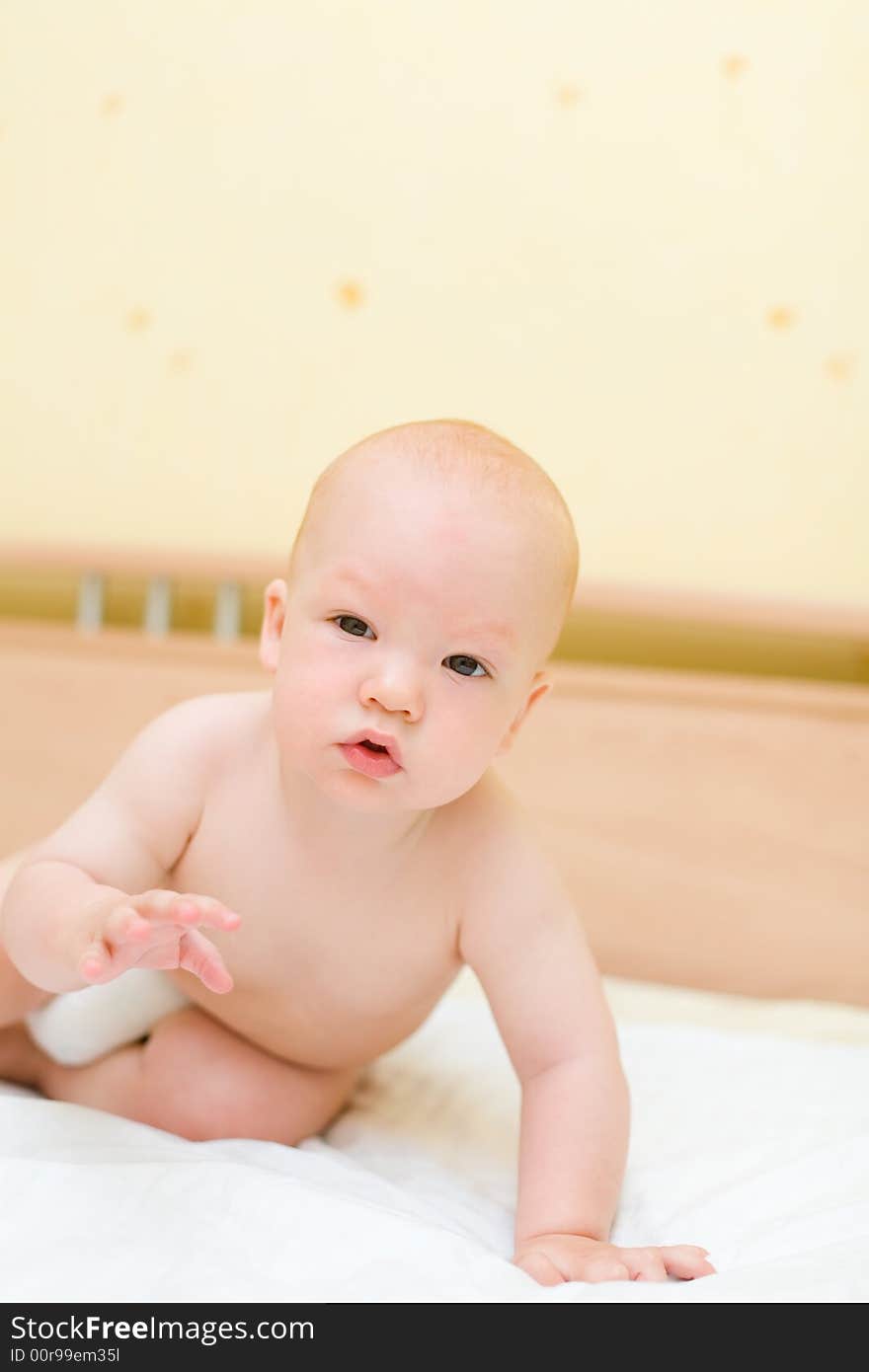 Toddler crawling on bed #2. Toddler crawling on bed #2