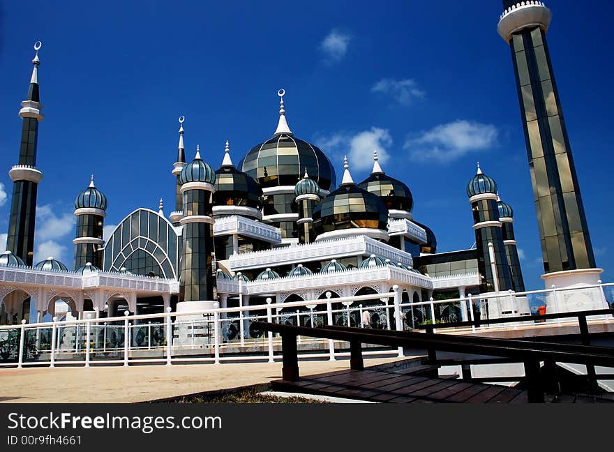 Mirror mosque on the blue sky background