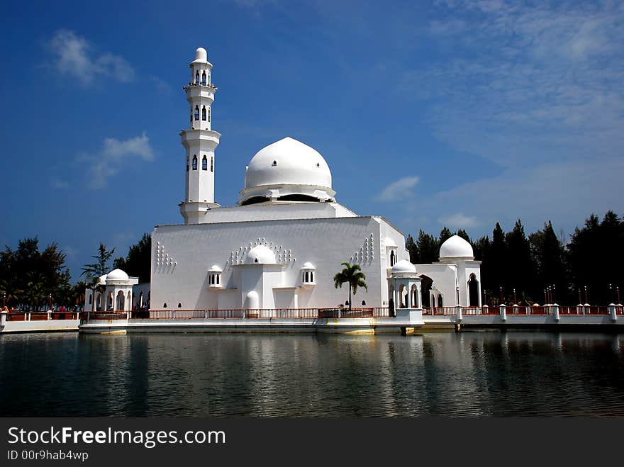 Flouting mosque on the blue sky background