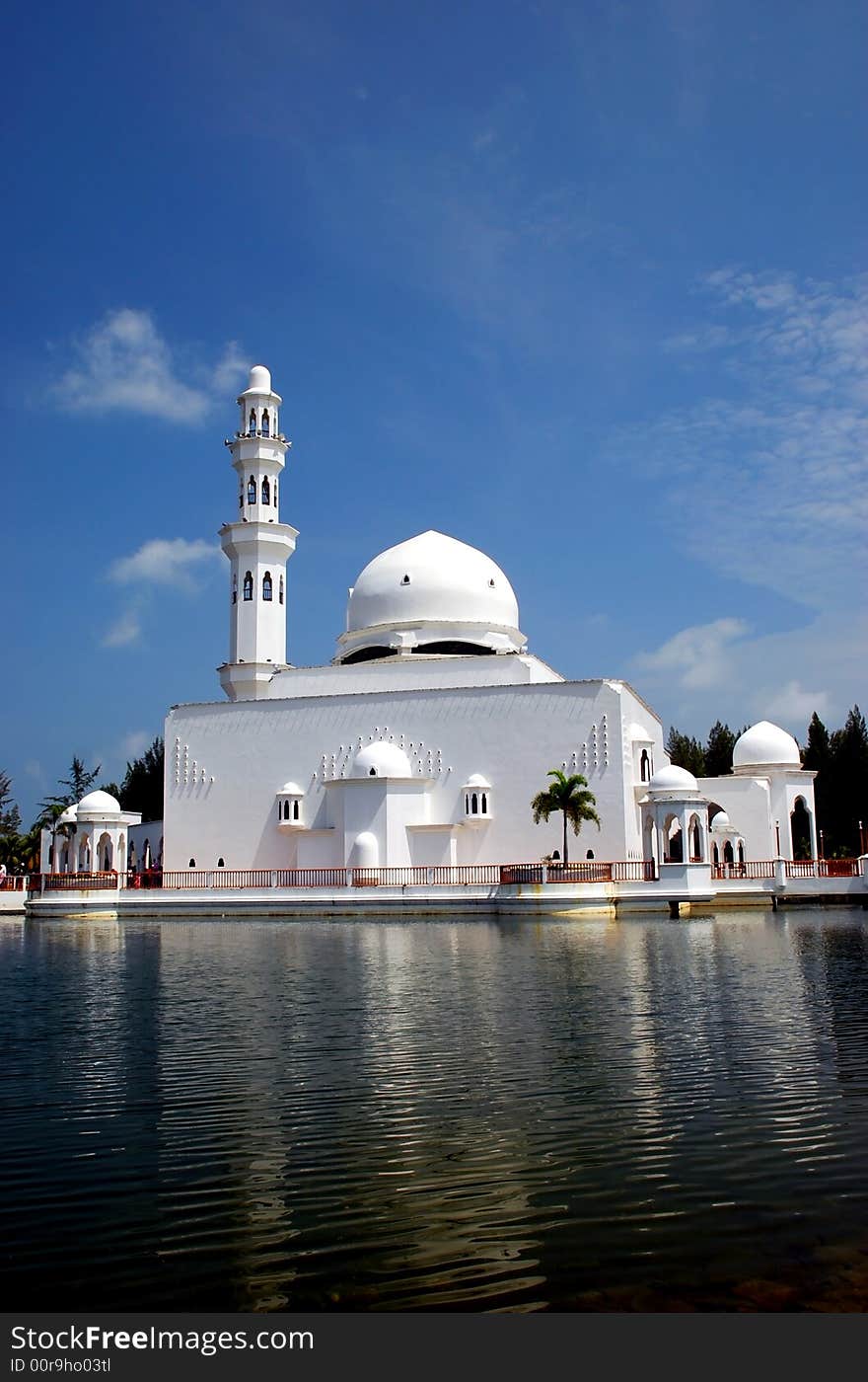 Flouting mosque on the blue sky background