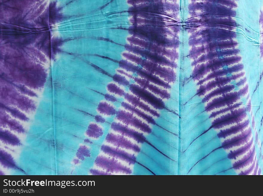 Purple and blue tie dyed material. Purple and blue tie dyed material.