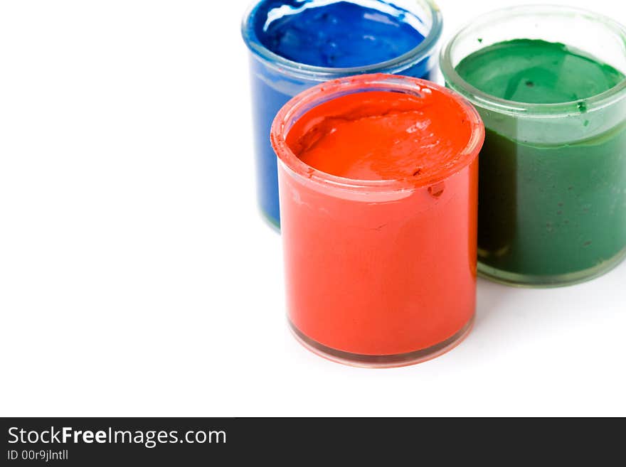 Three opened jar with gouache paints red green blue. Three opened jar with gouache paints red green blue