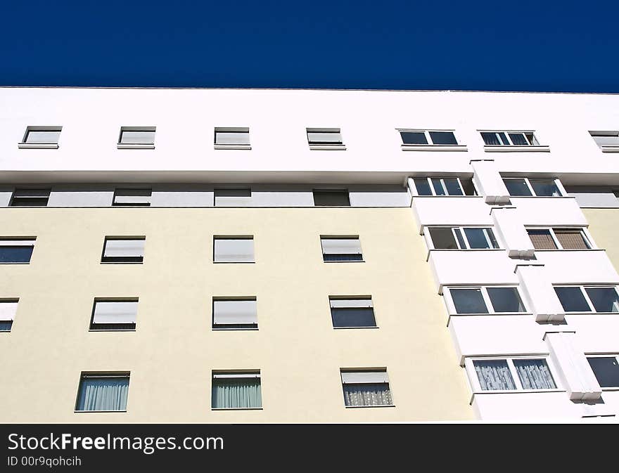 New modern building in colours with blue sky above