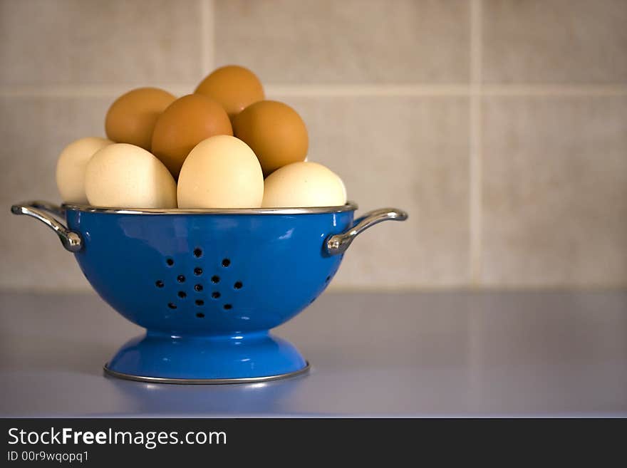 Blue colander filled with eggs