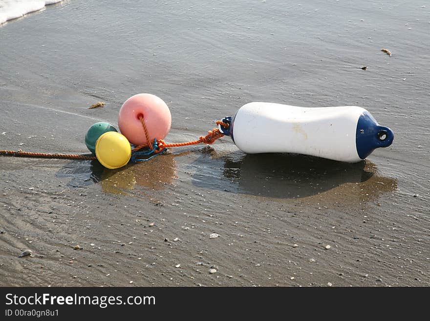 A buoy washed up on the beach after a big storm