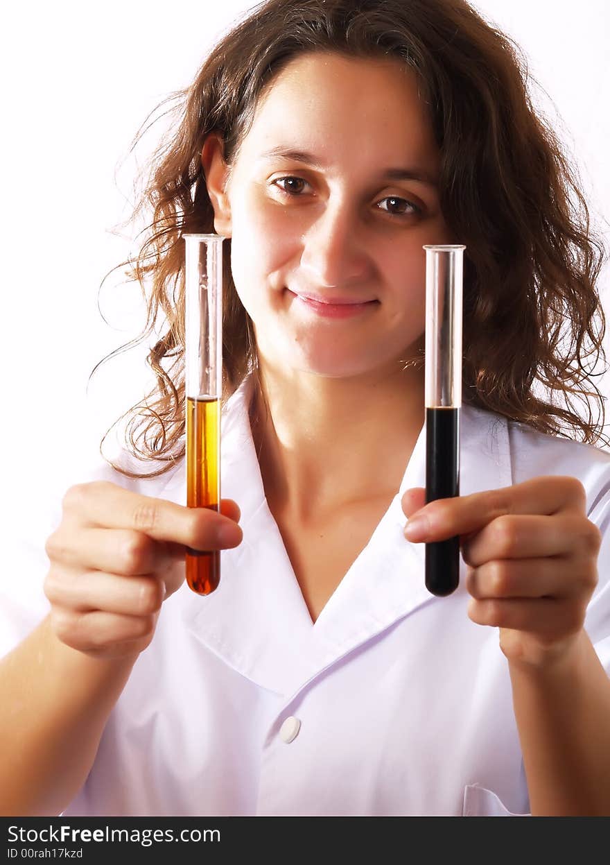 Scientist using test tubes and smiling. Scientist using test tubes and smiling