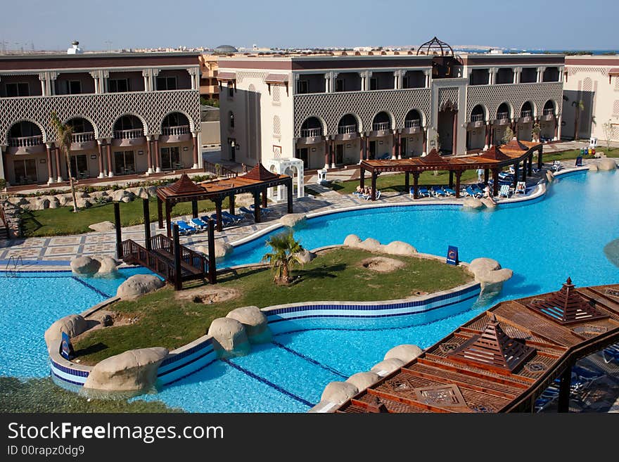 Oriental hotel with island in swimming pool