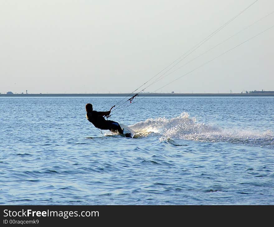 Silhouette of a kite-surf on waves of a gulf 2. Silhouette of a kite-surf on waves of a gulf 2