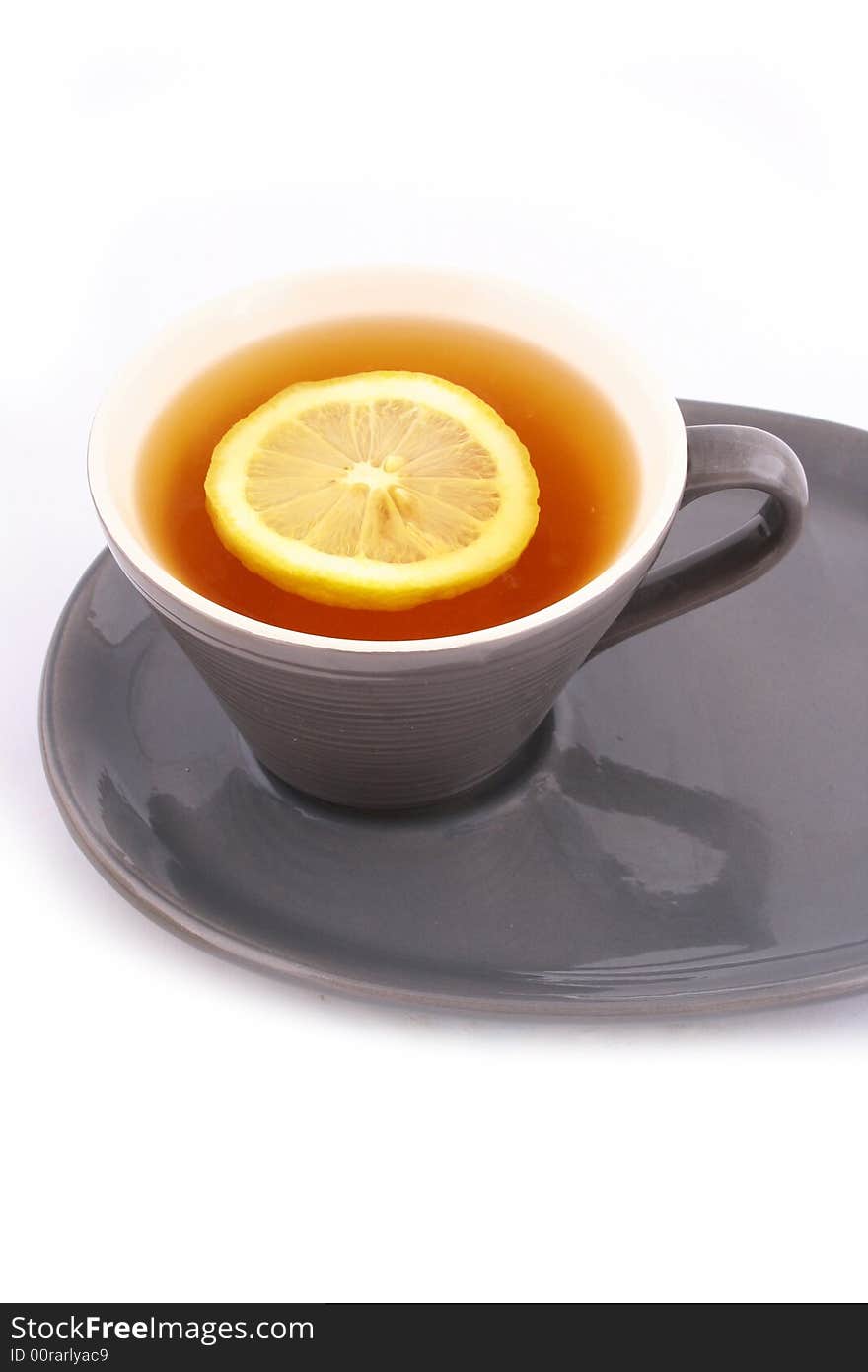 Cup of tea with a lemon