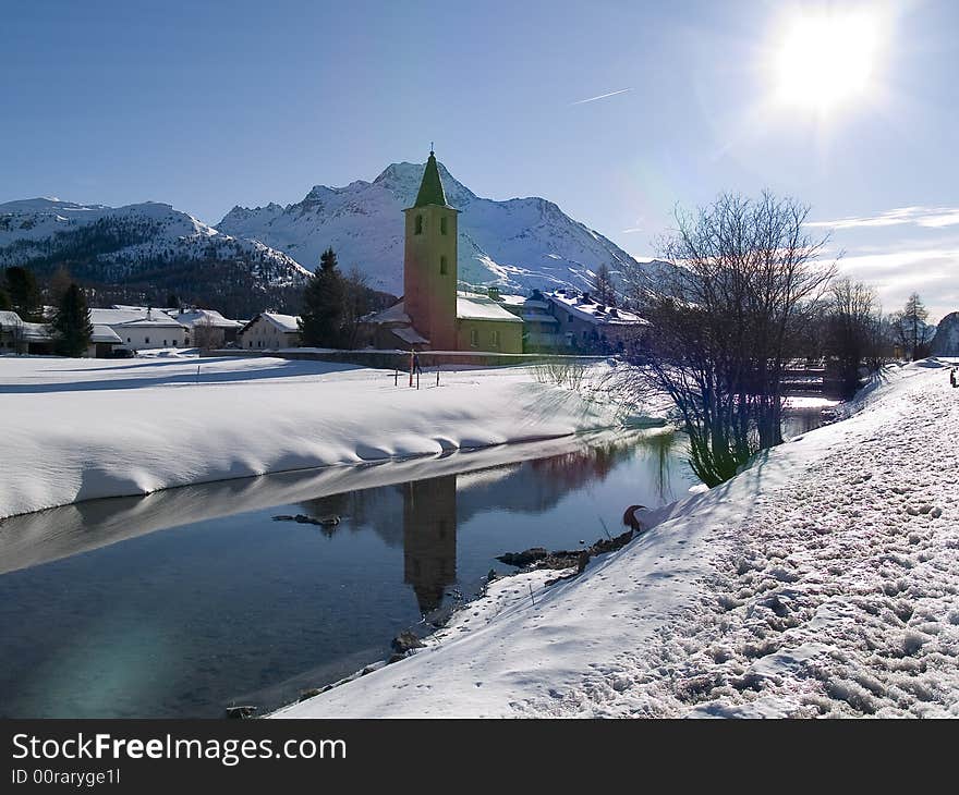 Small church on the banks of a river snow (Switzerland). Small church on the banks of a river snow (Switzerland)