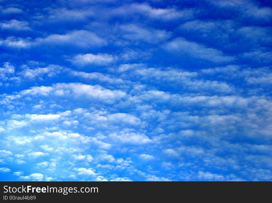 Photo of clouds taken against a blue sky. Photo of clouds taken against a blue sky