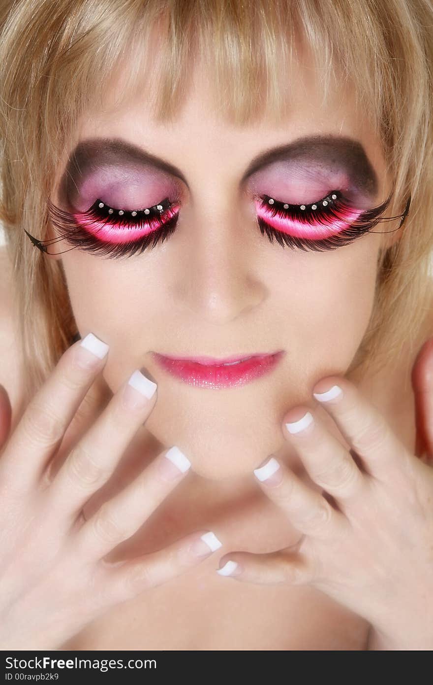 Beautiful 40 year old woman in artistic make-up with manicure. Beautiful 40 year old woman in artistic make-up with manicure.