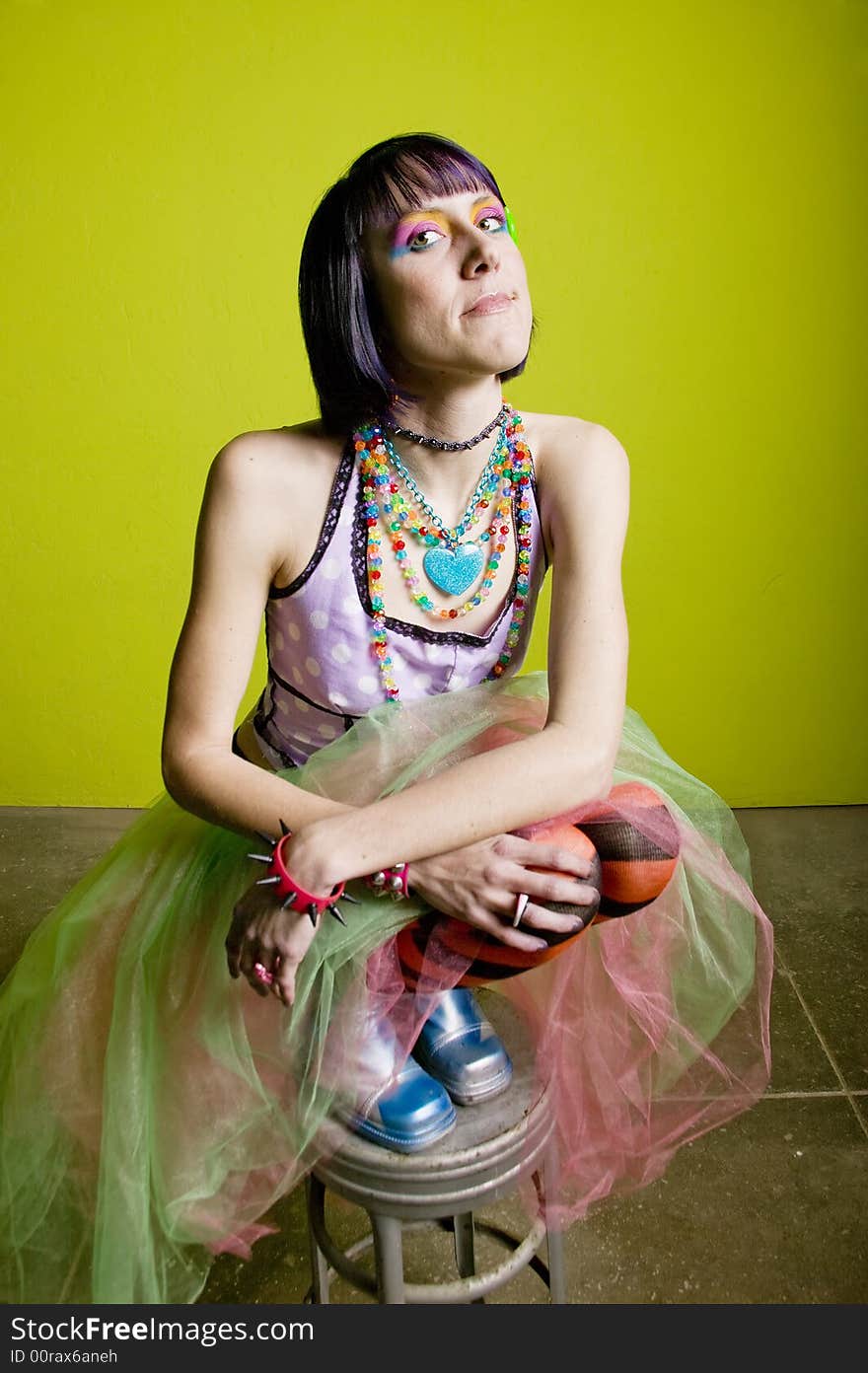 Pretty young woman with colorful punk clothes. Pretty young woman with colorful punk clothes.