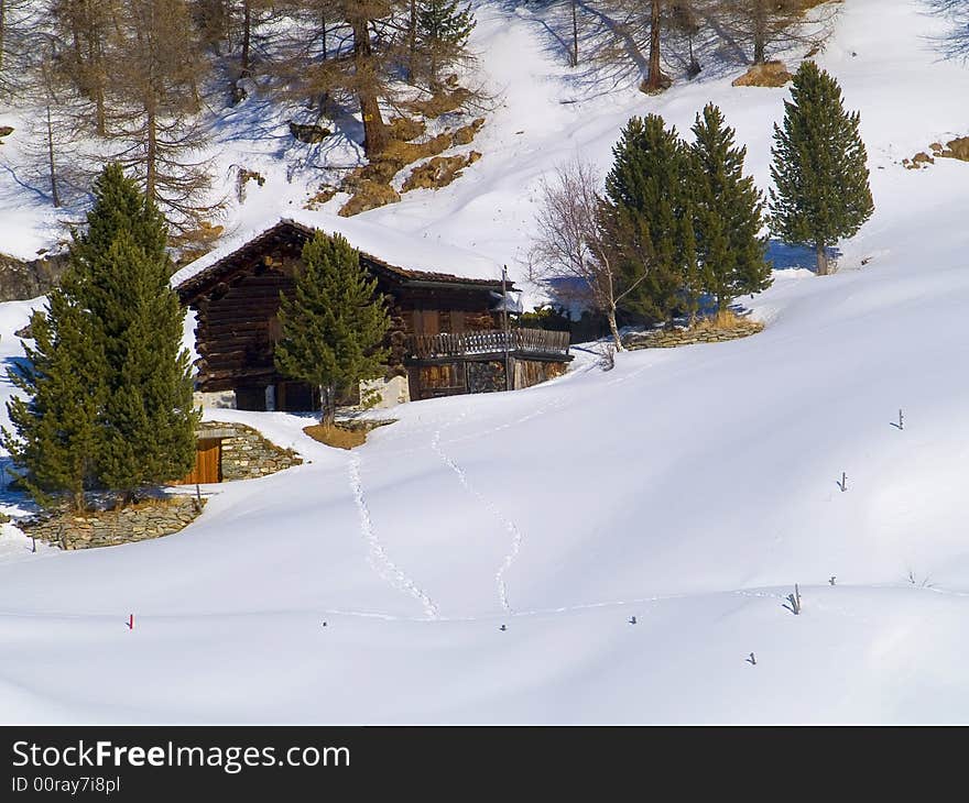 Challet between the snowy Swiss Alps