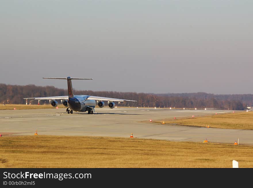 Airplane jet on a runway taking off, horizontal. Airplane jet on a runway taking off, horizontal