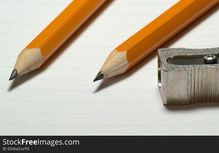 Image of two pencils with sharpener next to them - 1