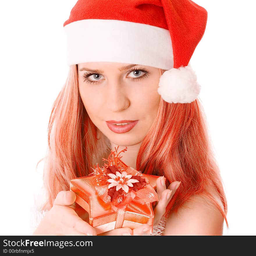 Winter portrait of a beautiful young red head woman holding a gift in her hands. Over white background. Winter portrait of a beautiful young red head woman holding a gift in her hands. Over white background