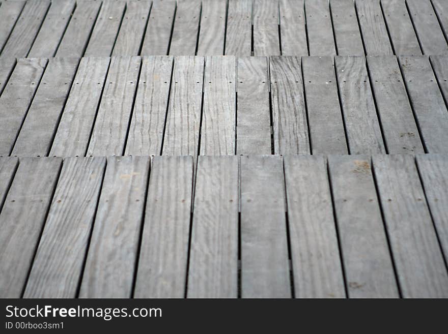 Wooden stairs on the sand of the beach. Closeup.