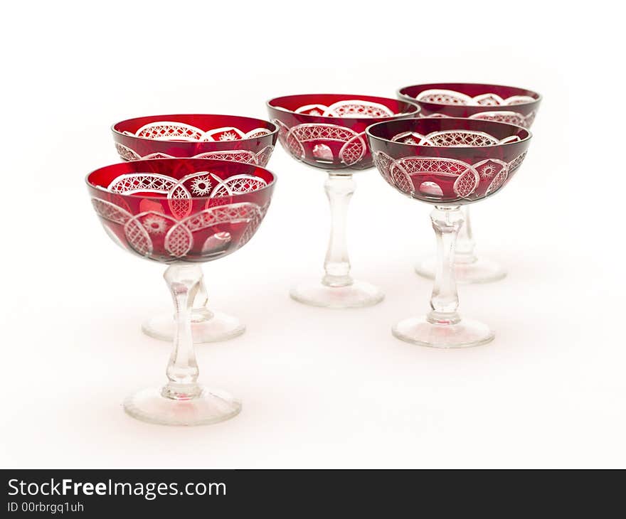 Empty red champagne glasses isolated on white background