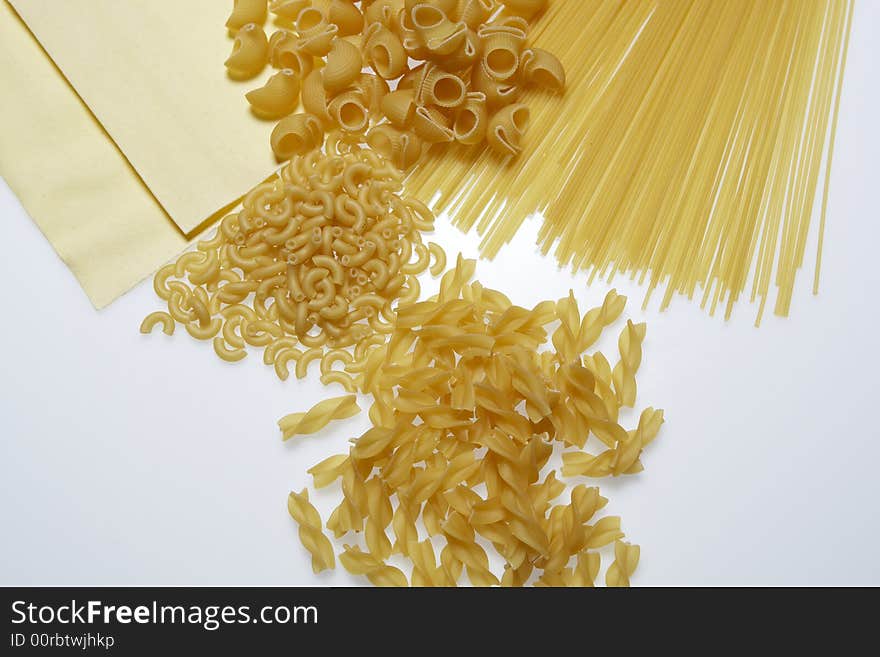 Variety of pasta on a white background