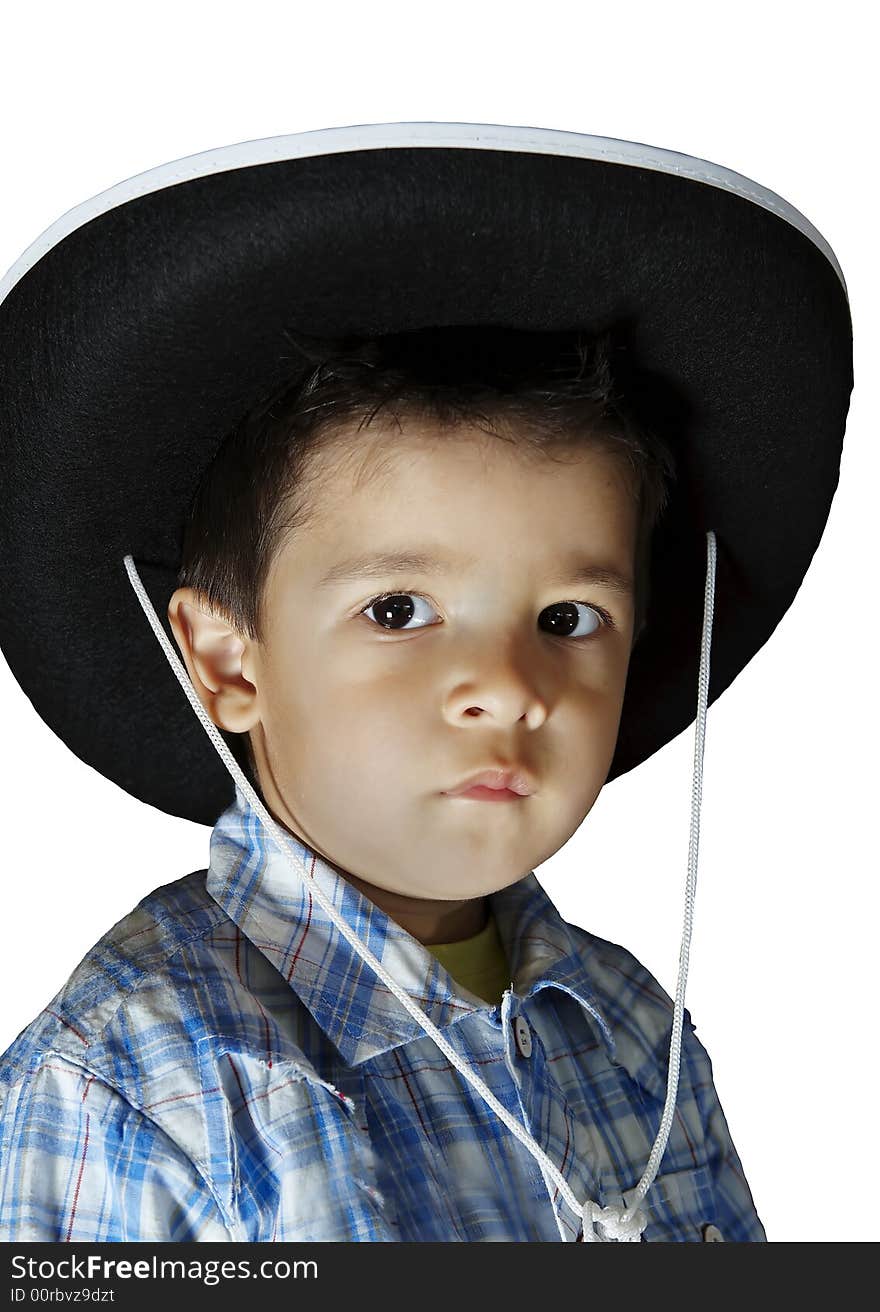 A little boy with a cowboy's hat. A little boy with a cowboy's hat